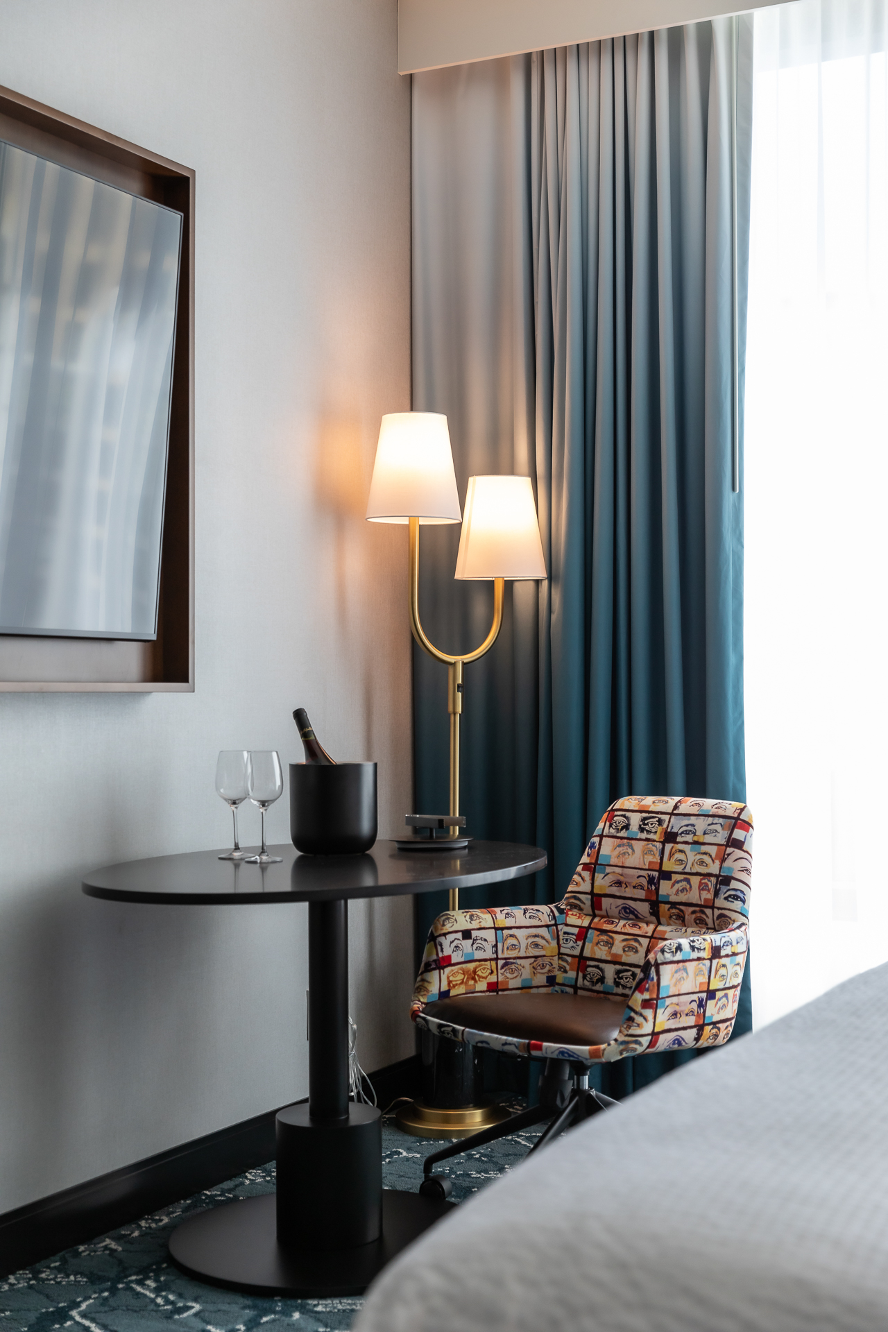 commercial photography of the bed and side table at Tempo Nashville