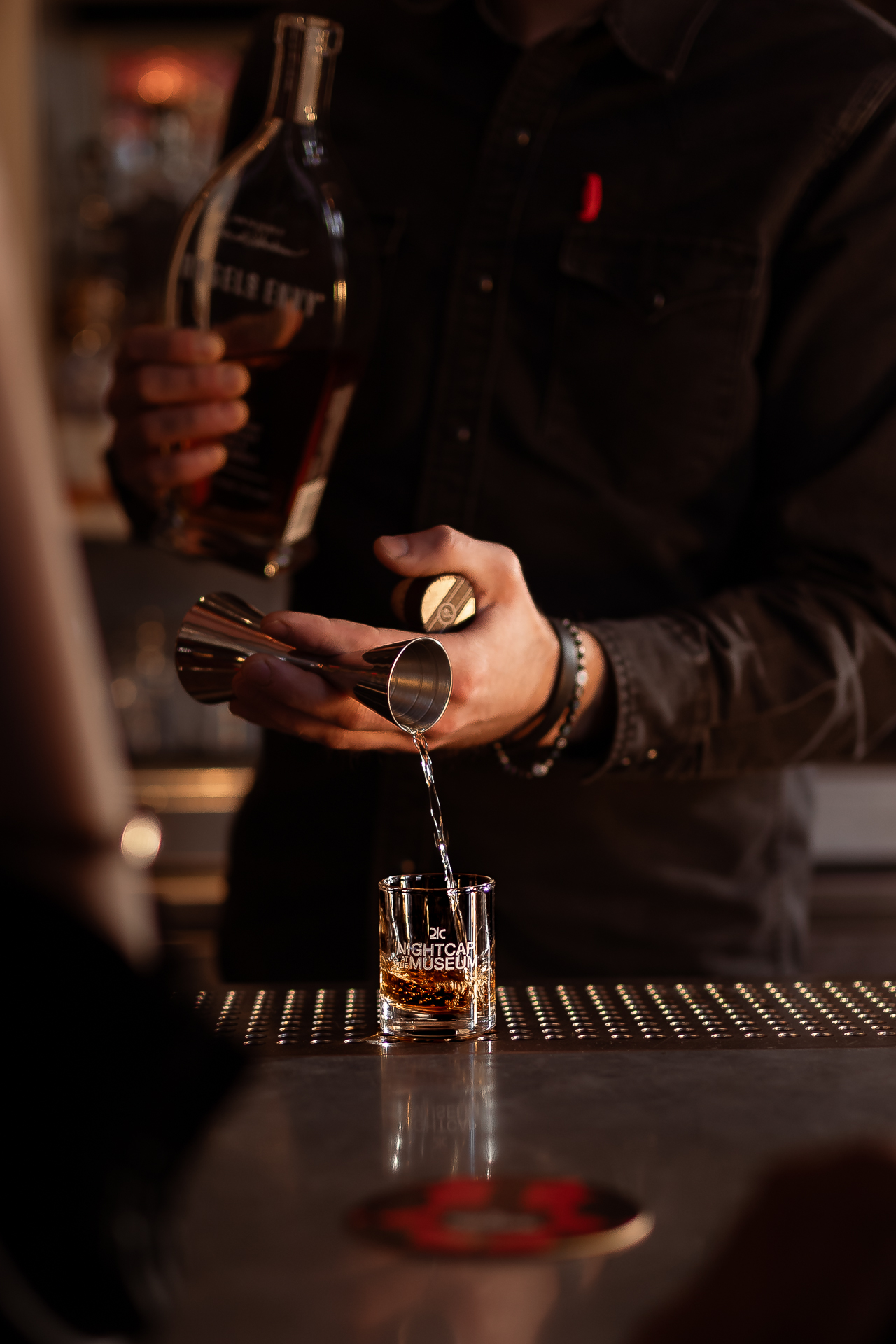 commercial photography at 21C museum hotel of a drink being poured at the bar