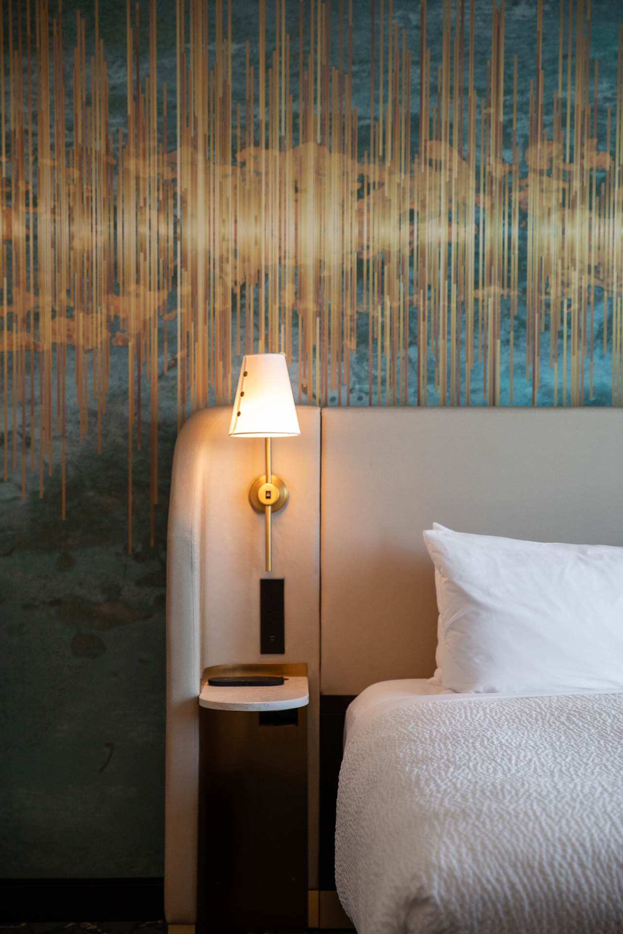 commercial photography of a bed in a guest room at Tempo Nashville