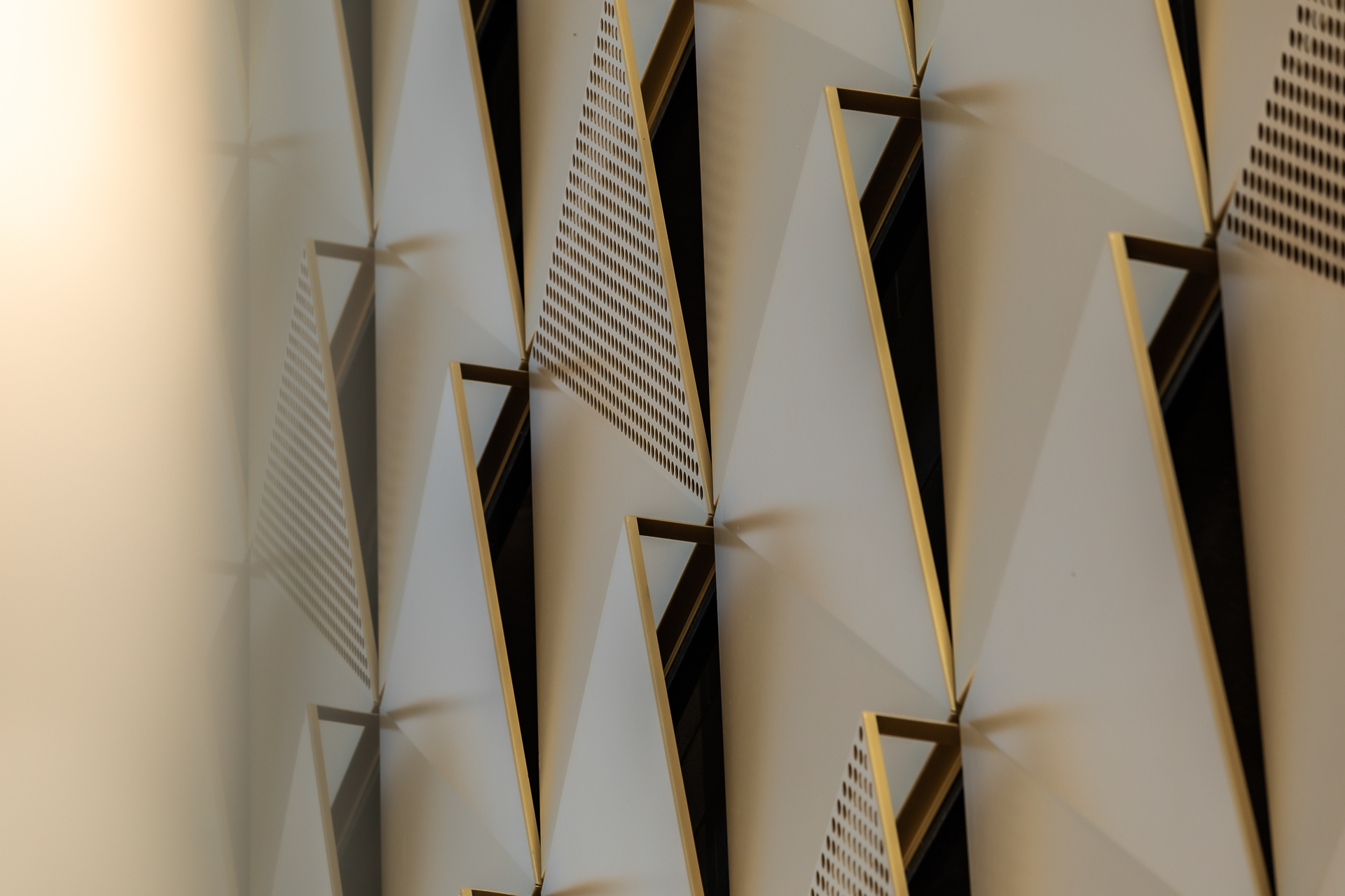 commercial photography of gold panels on the exterior of the building at Tempo Nashville