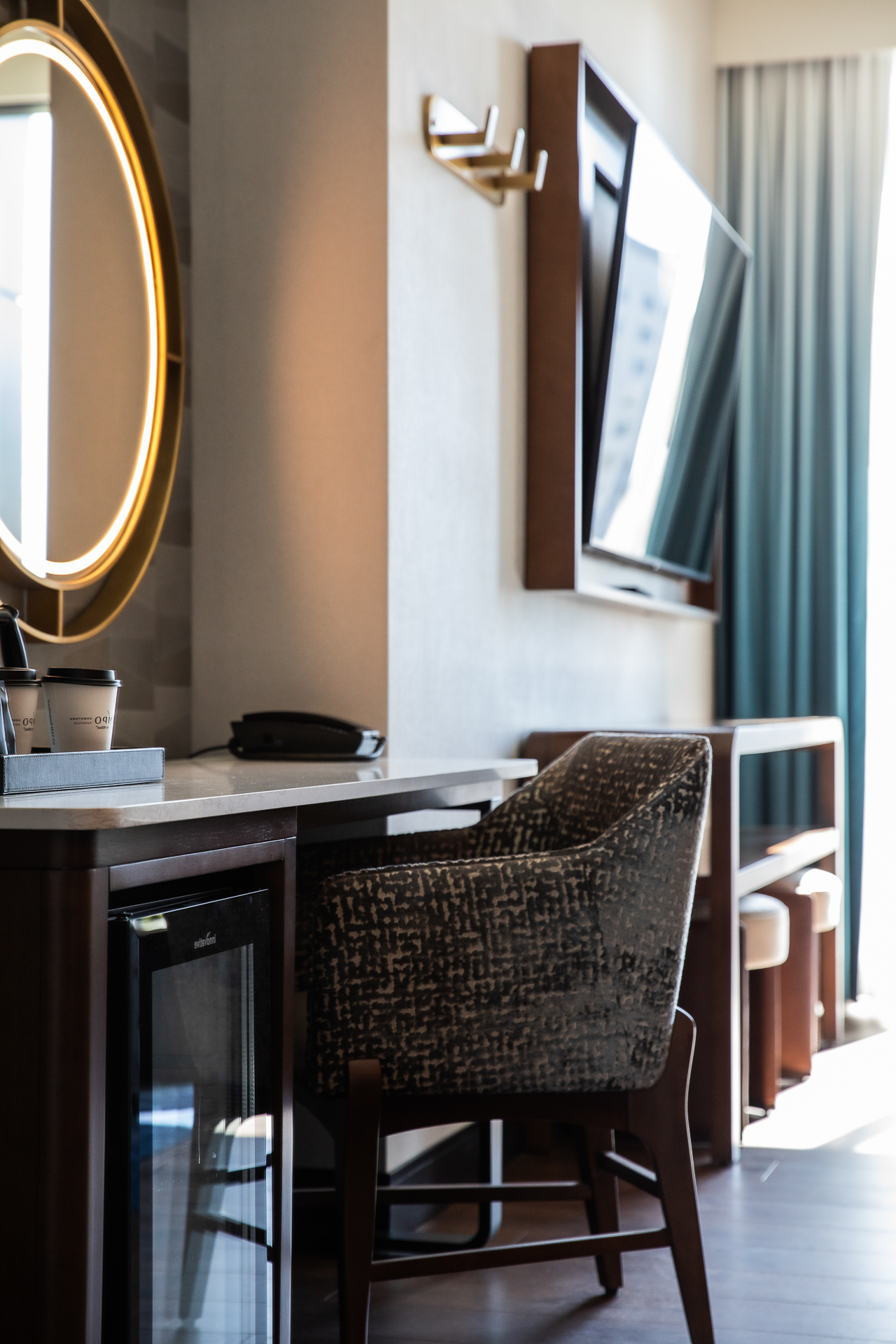 commercial photography of the desk and guest room at Tempo Nashville