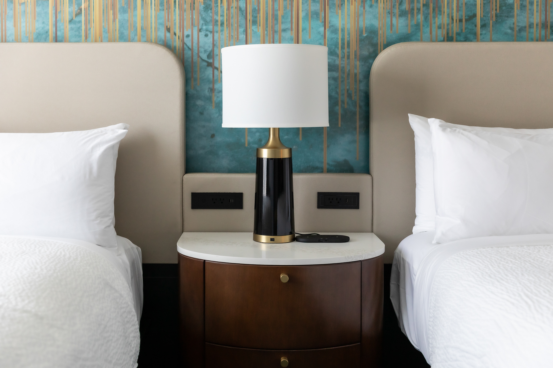 commercial photography of two beds and lamp at Tempo Nashville
