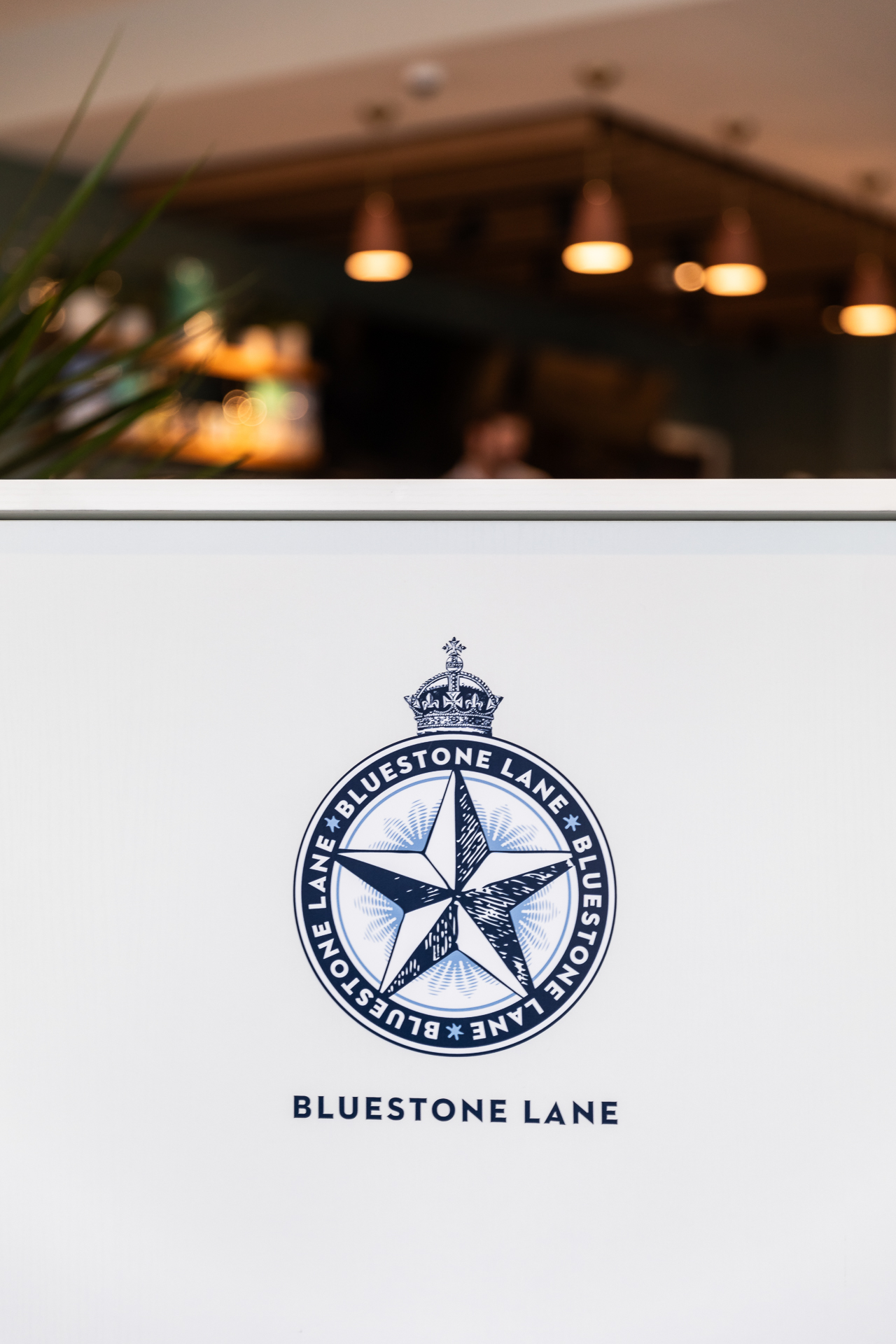 commercial photography of the check in counter at Bluestone Lane in Tempo Nashville