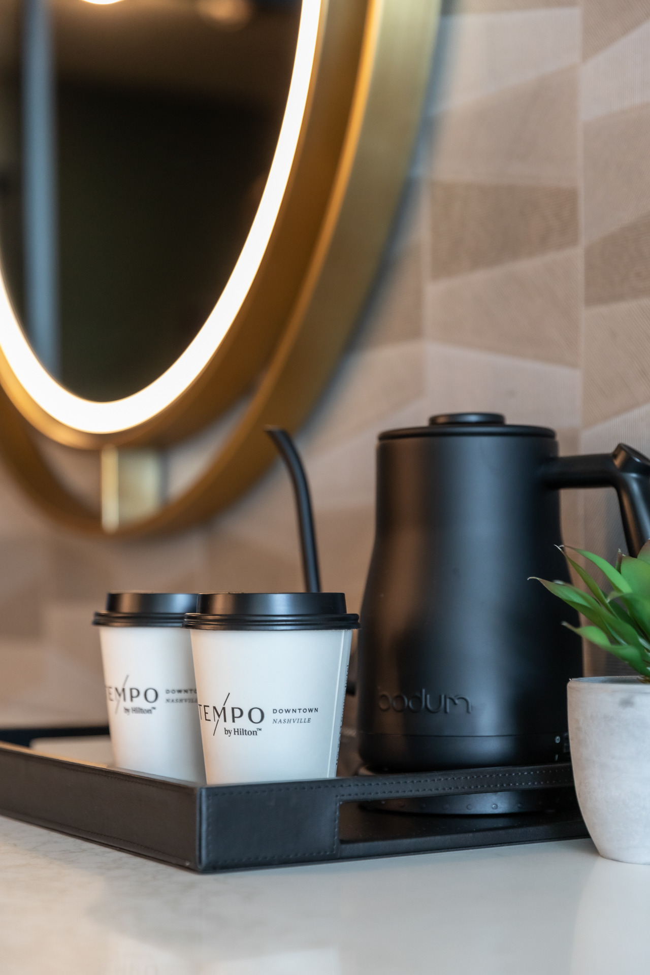 commercial photography of a guest room with coffee cups and kettle