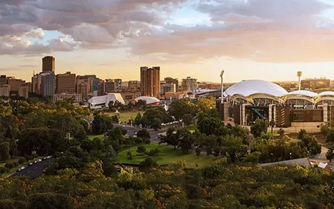 An aerial view of a city with a lot of trees.