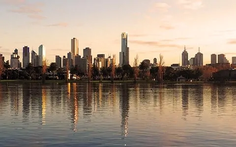 A large body of water with a city in the background.