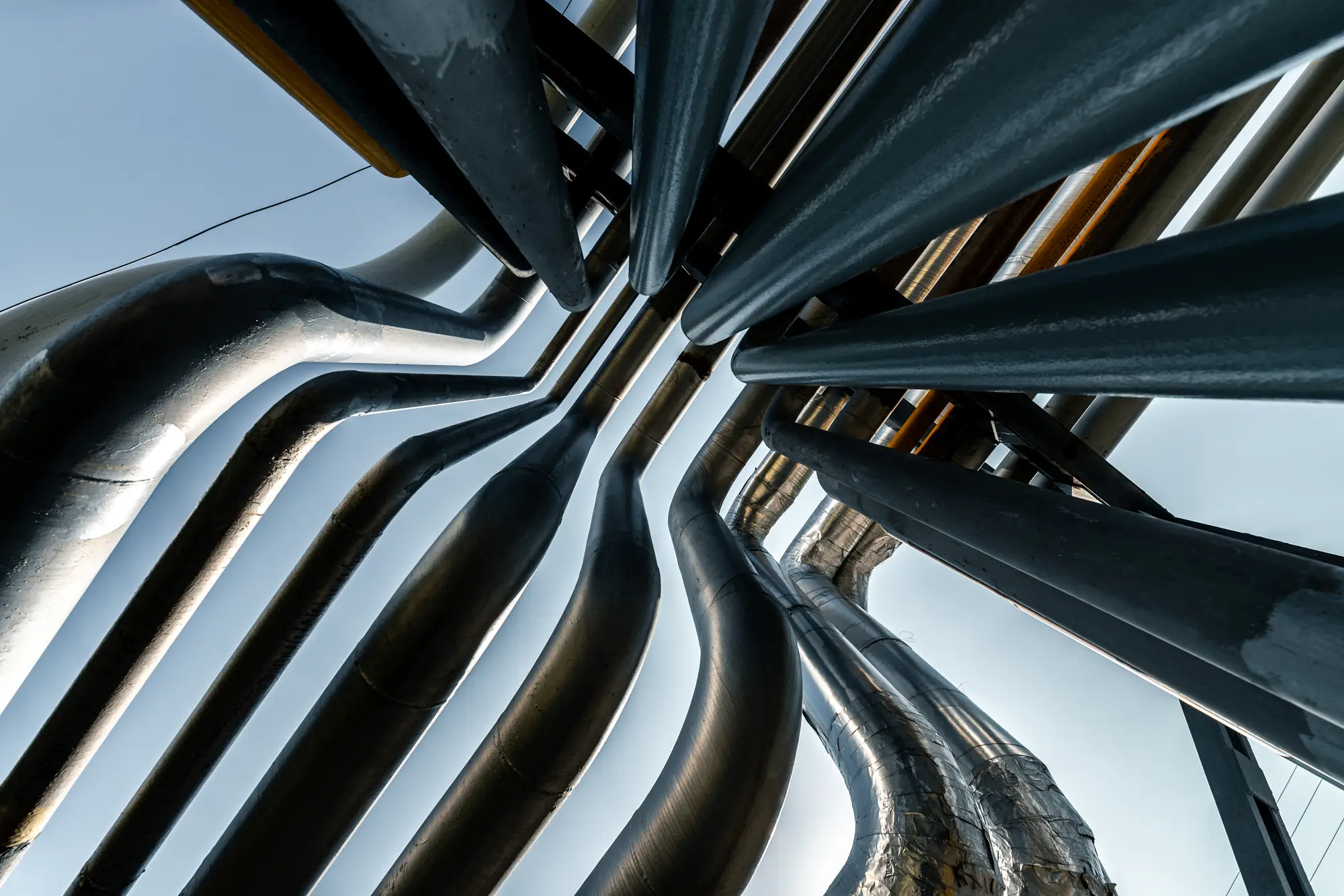 An artisticly taken photograph of metal pipe detailing, creating a geometric pattern.