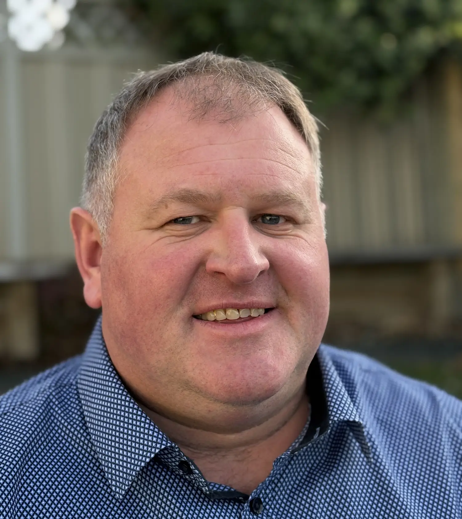 Darryn Wilkie smiling outside