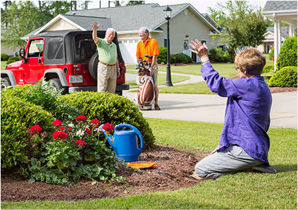 Residents gardening outside at The Village at Woods Edge.