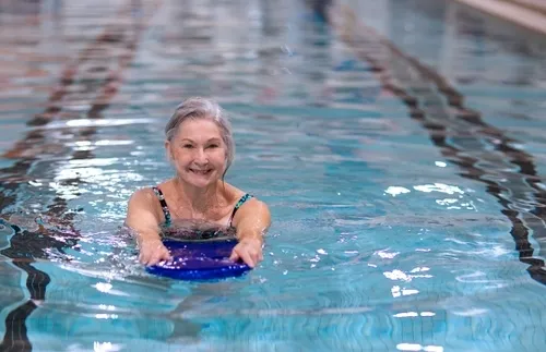 Residents of The Village at Woods  Edge swimming.