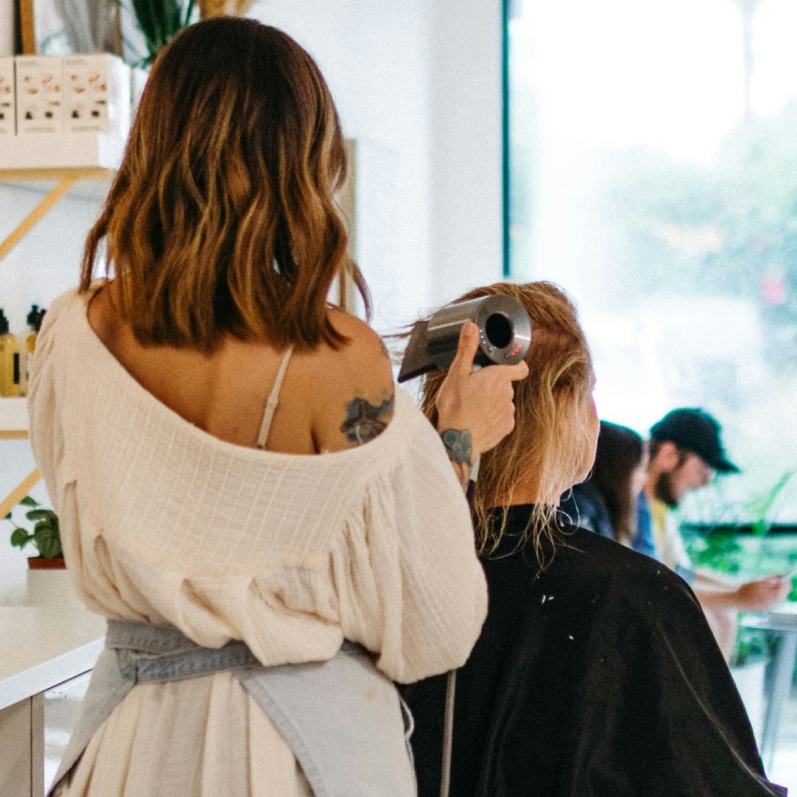 Sole Trader styling client's hair