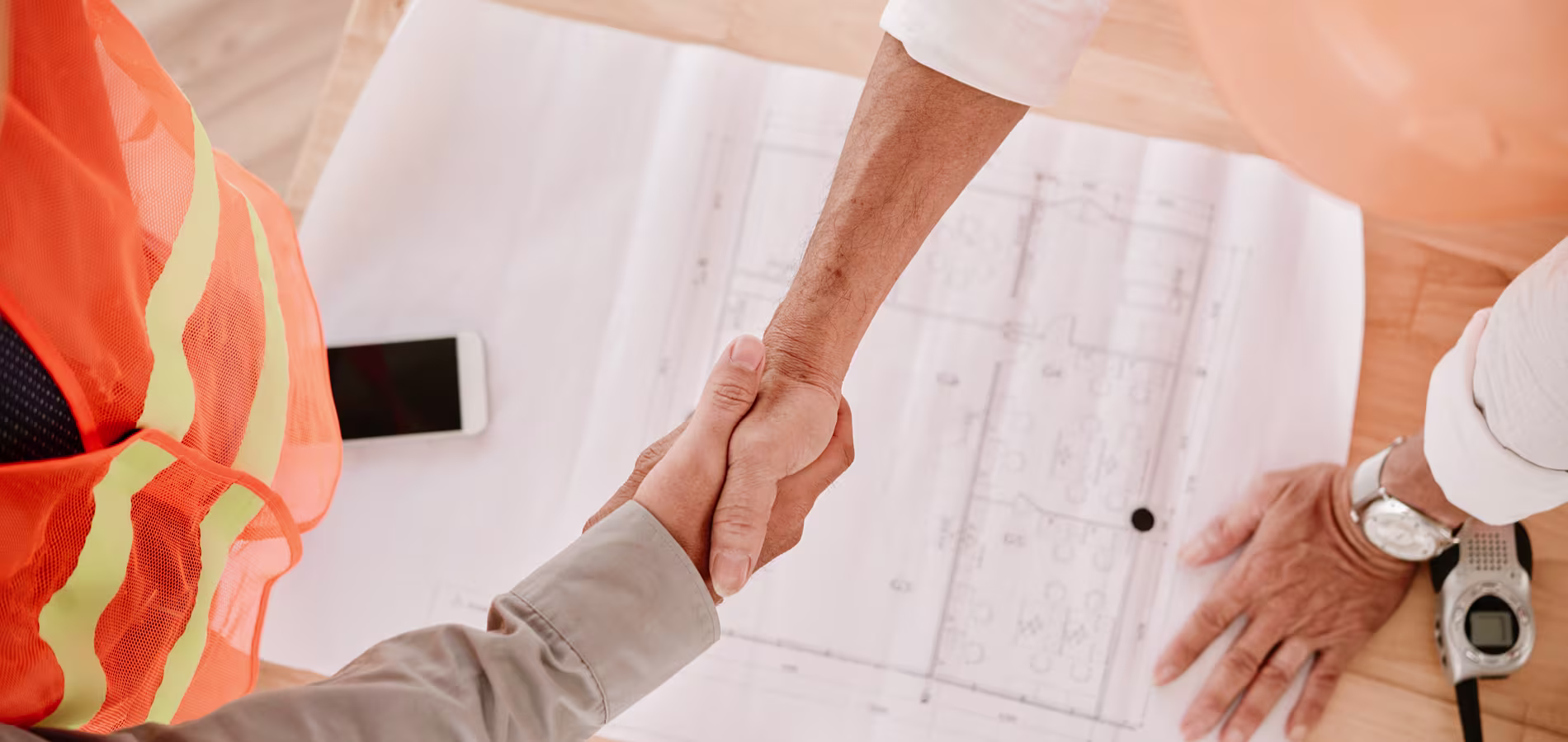 client-and-contractor-shaking-hands-after-renovation-contract-deal