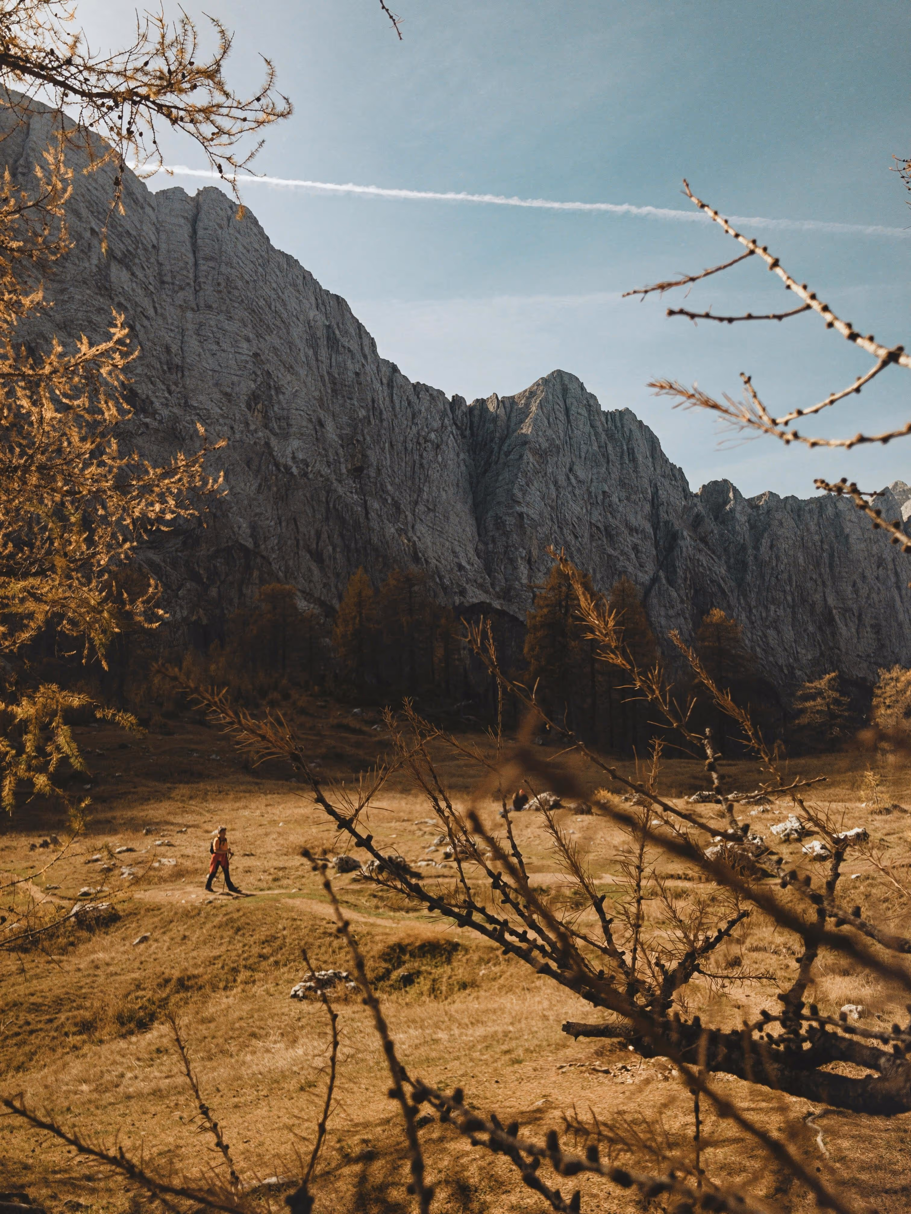 Hiker walking in a mountain valley