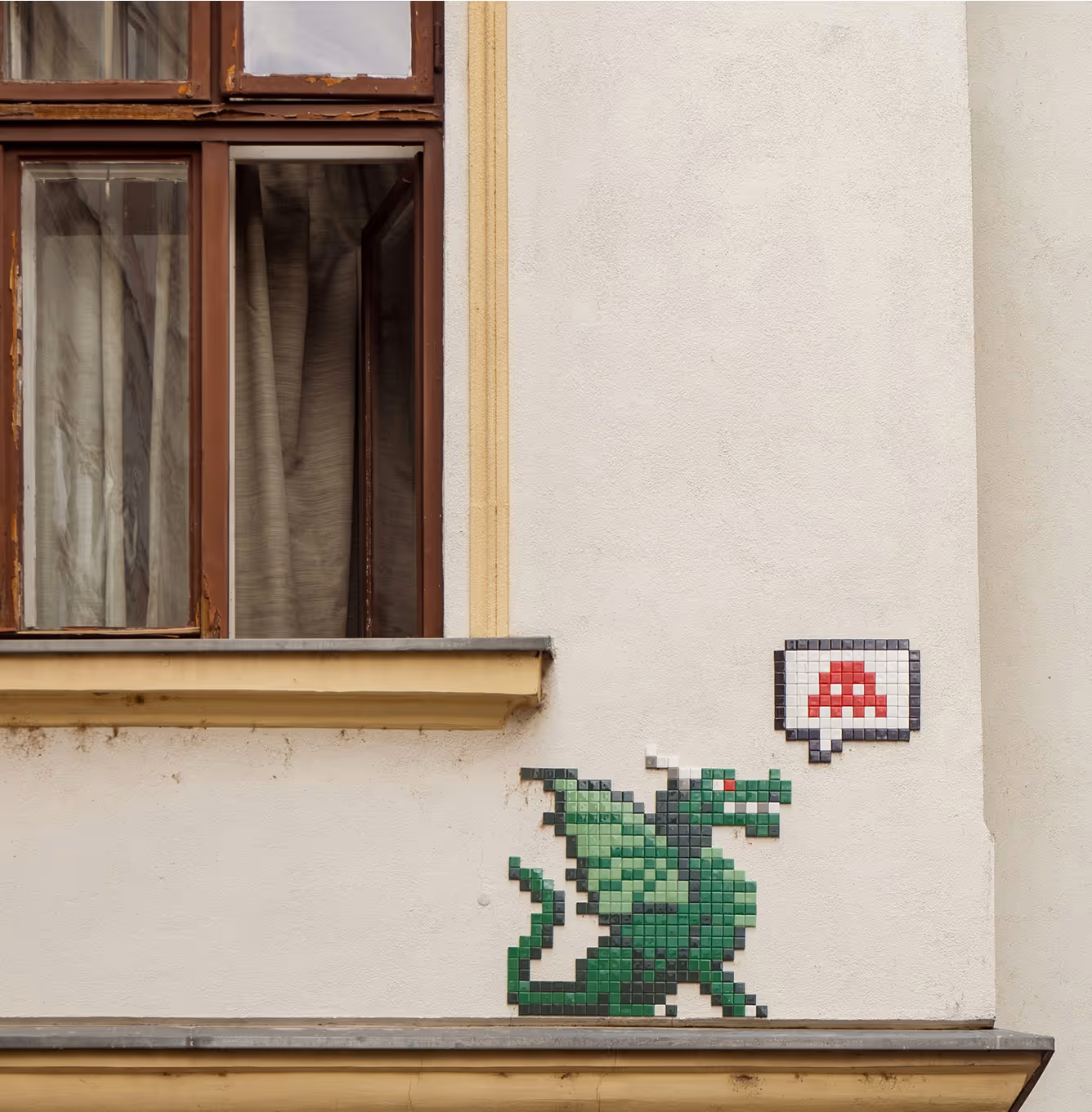 Pixel art dragon on a building wall
