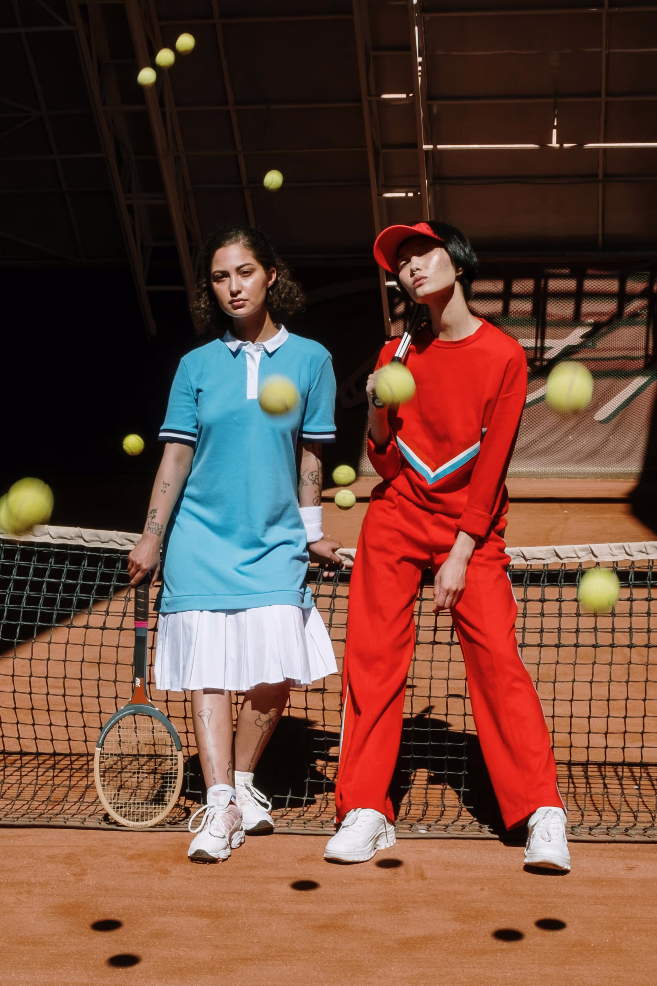 Two girls in tennis outfits
