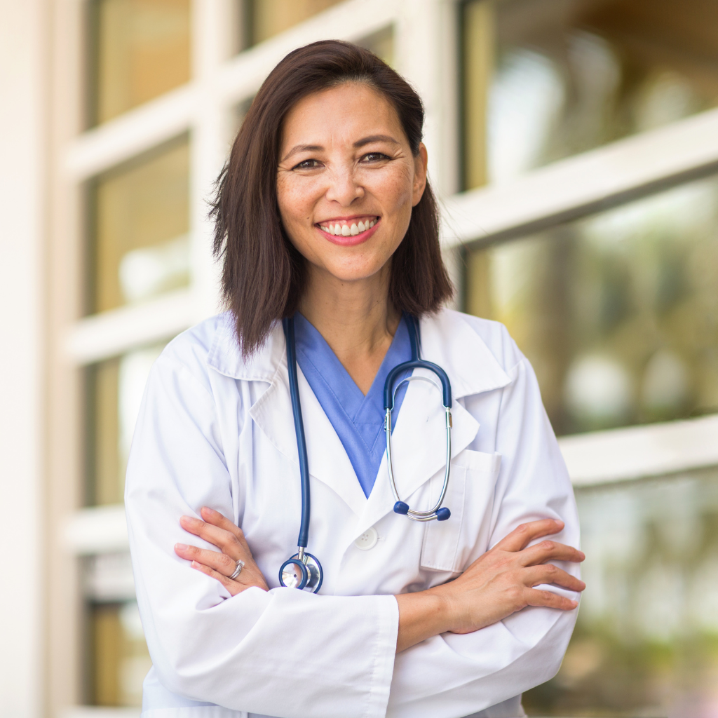 healthcare professional arms folded and looking forward smiling
