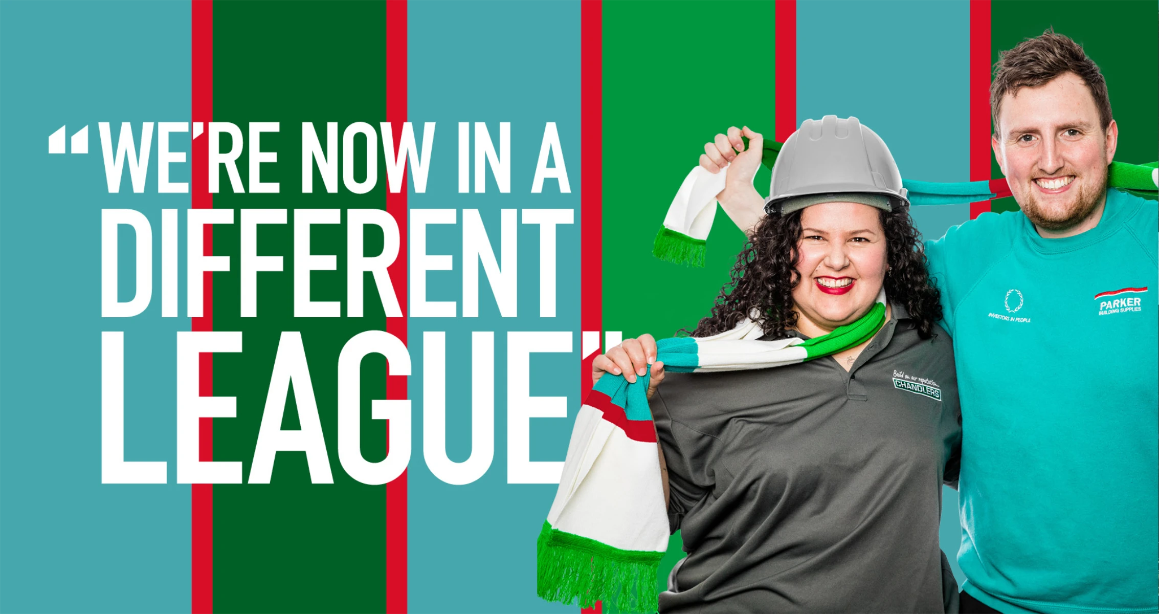 Two happy people on a striped blue, green ad red background with the text "we're now in a different league"