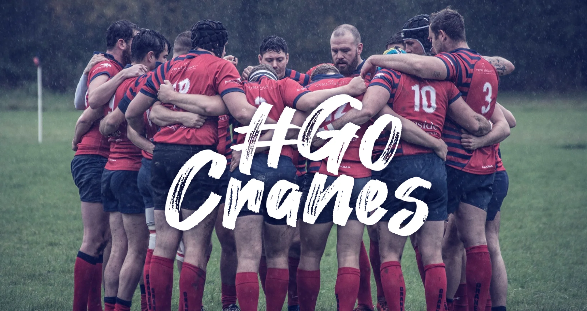 CRFC rugby team huddling with #GoCranes in white overlayed.