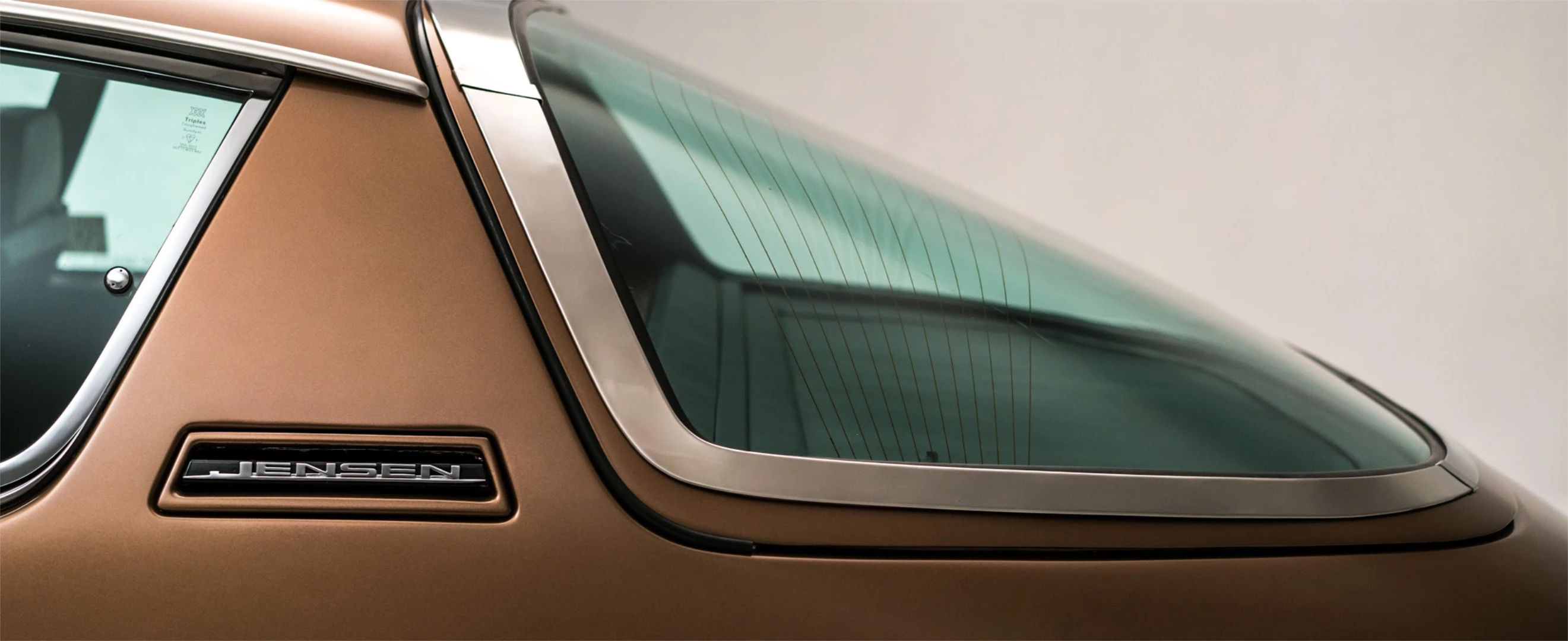 Closeup shot of a brown and chrome luxury British classic car