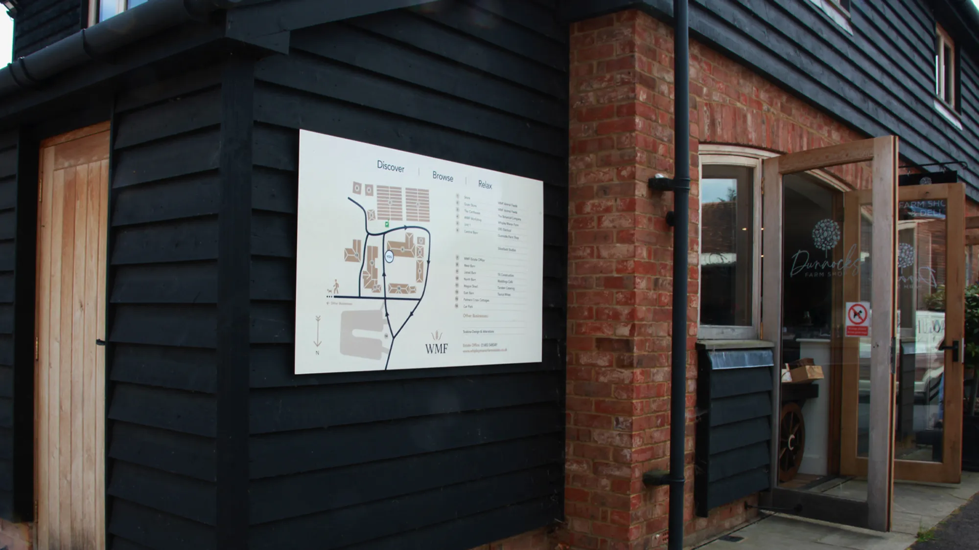 A map of Whipley Manor Farm in their brand colours: blue, beige and cream. This map is on the wall of a barn in Whipley Manor Farm