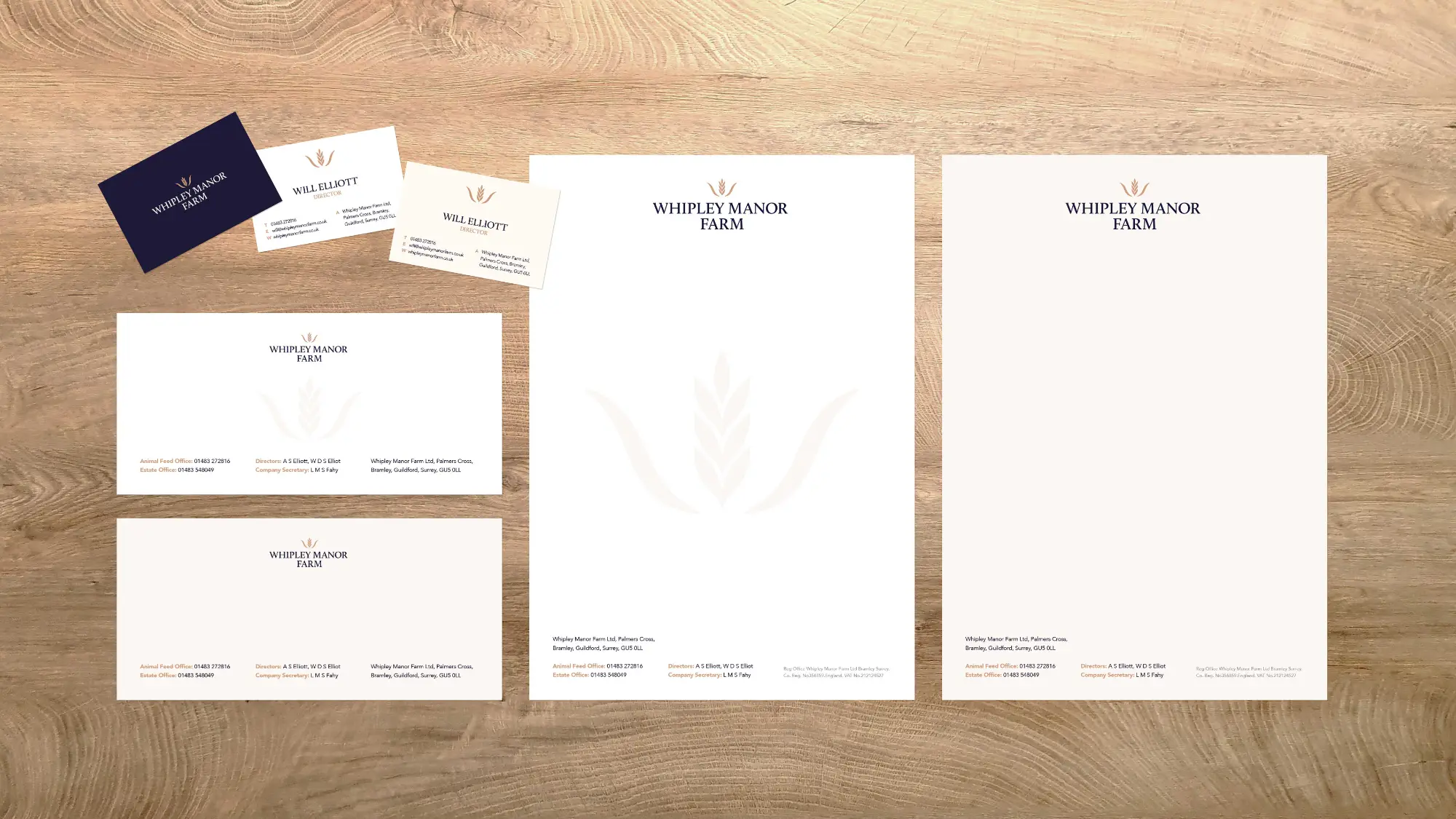Whipley Manor Farm branded headed paper, envelopes and business cards on a wooden table.