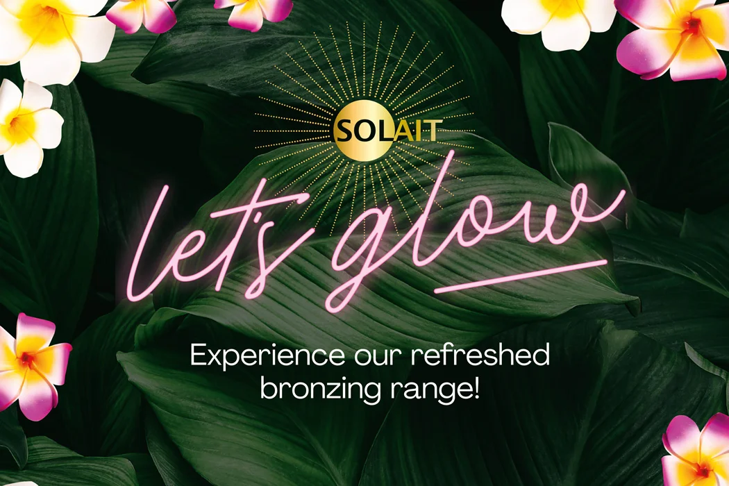SOLAIT logo with radiating gold rays above neon pink text 'let’s glow' and phrase 'Experience our refreshed bronzing range!' on dark green leaves background with pink and white flowers.