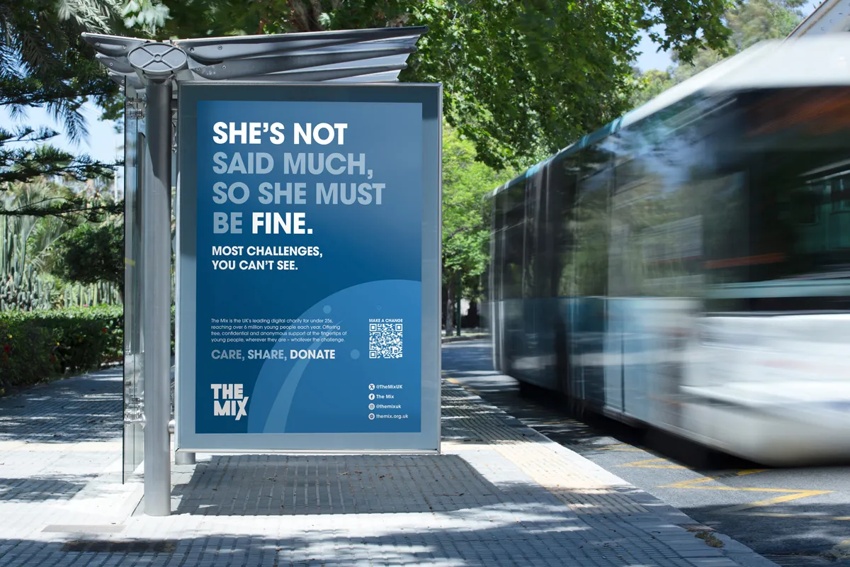Blue bus stop poster reading, 'She's not said much, so she must be fine. Most challenges you can't see.' promoting The Mix charity for young people.