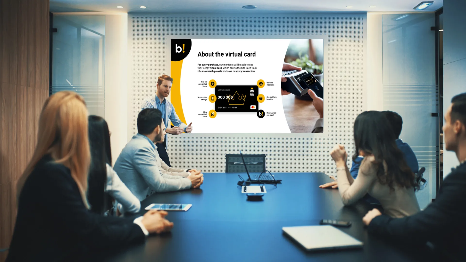 Business meeting in a conference room with a presenter explaining a virtual 'beep! branded' slide on a screen to seated colleagues.