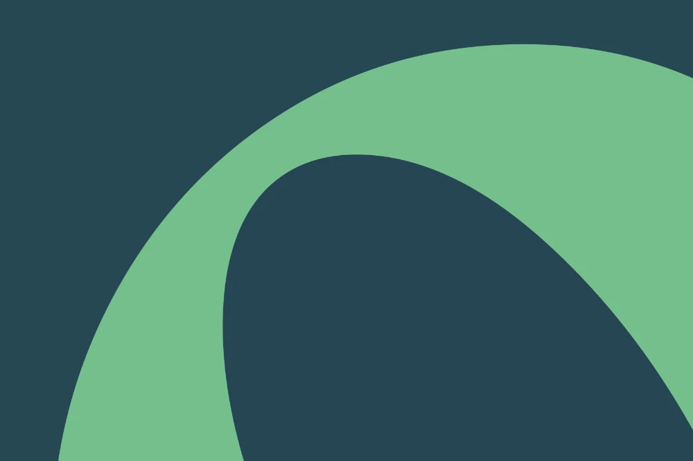 A graphical element used throughout the Coastland College branding - a green letter that is really large and bleeding off the viewport to create a swoosh.