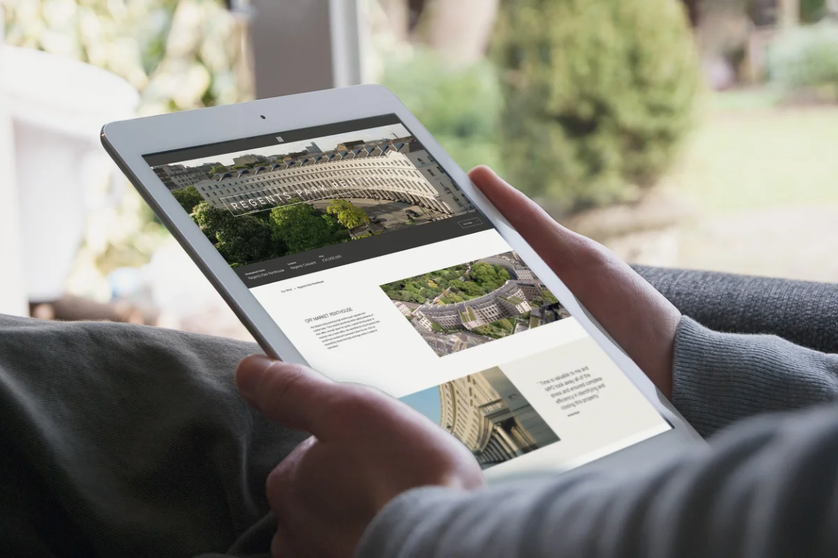 Person using the Mayfair Private Office website on a tablet.