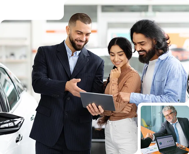 Car salesman showing a tablet to a smiling couple inside a car dealership showroom.