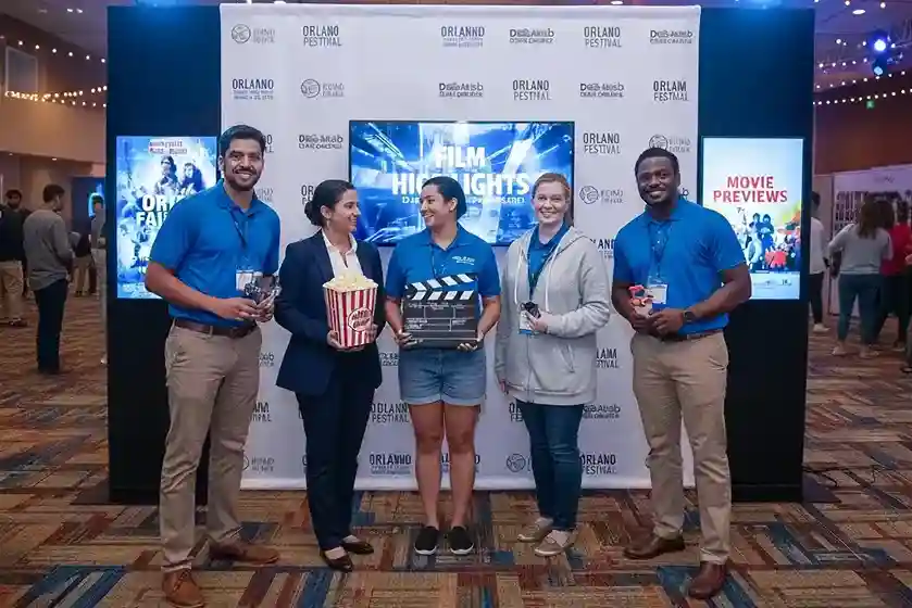 image of a music festival with vibrant colorful smoke