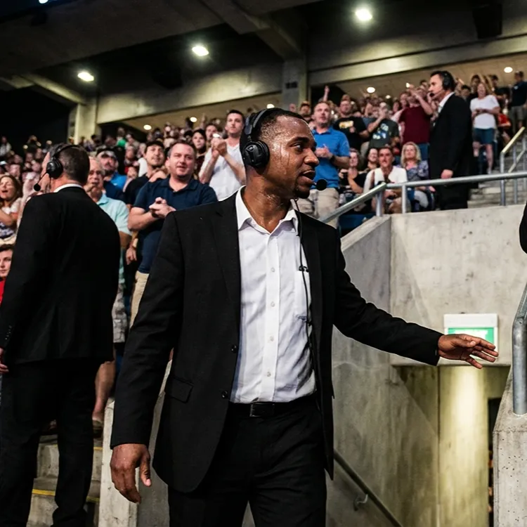 image of a music festival with vibrant colorful smoke