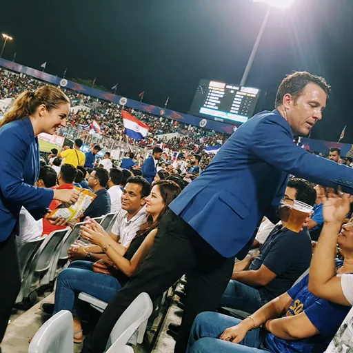 image of a music festival with vibrant colorful smoke