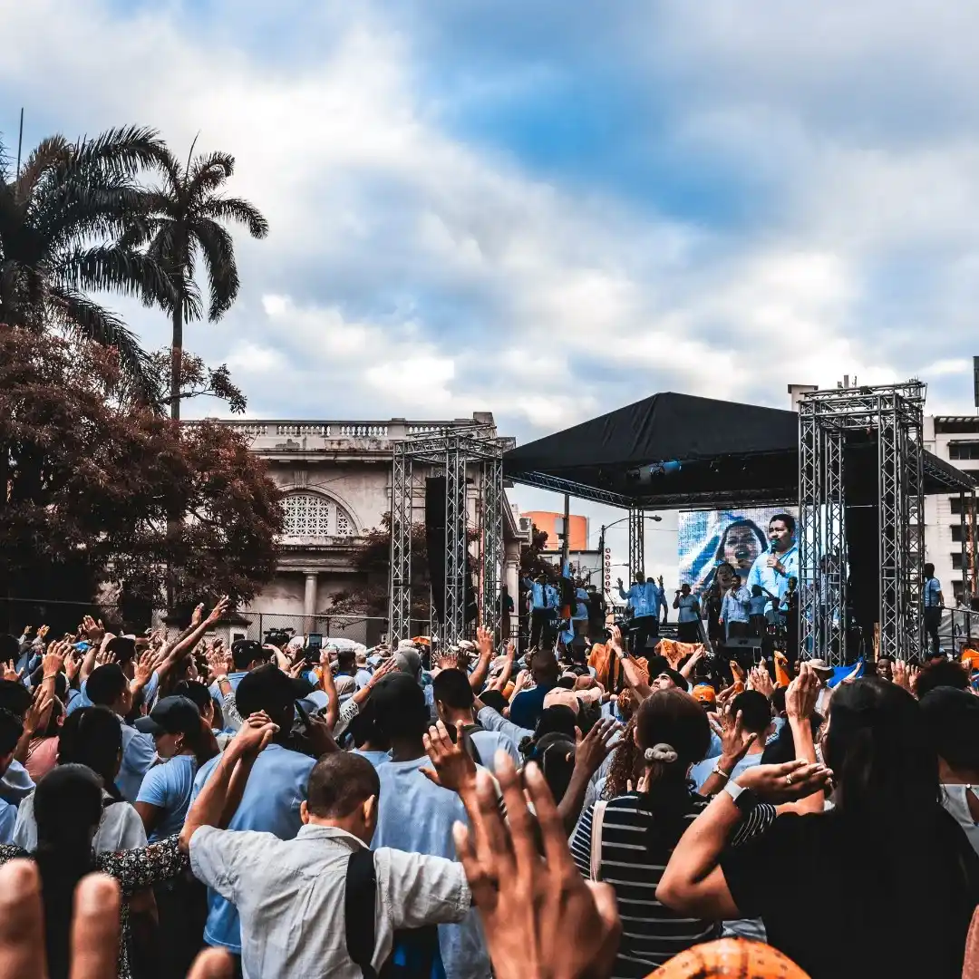 image of a music festival with vibrant colorful smoke