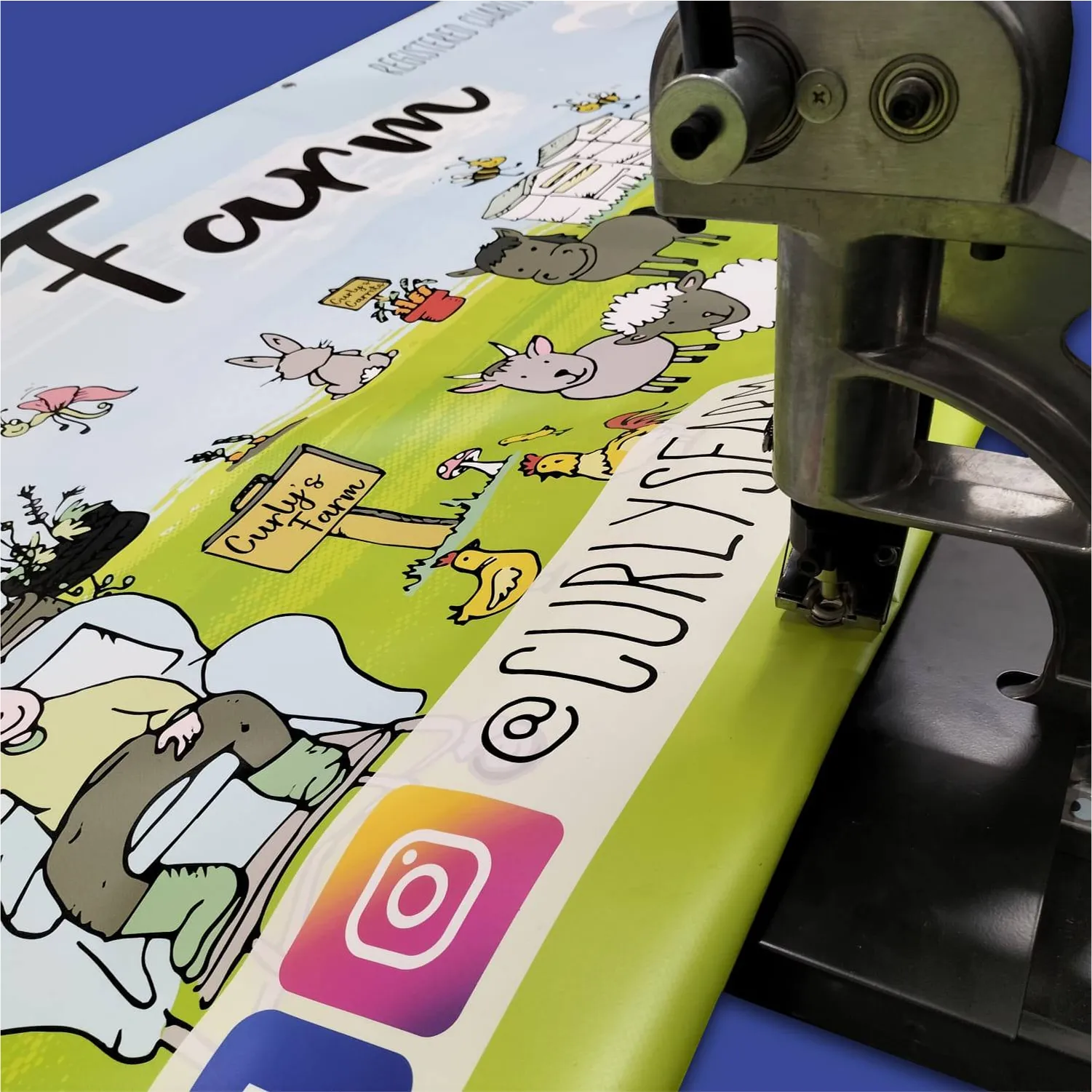 Cartoon animals on printed page under printing machine close-up