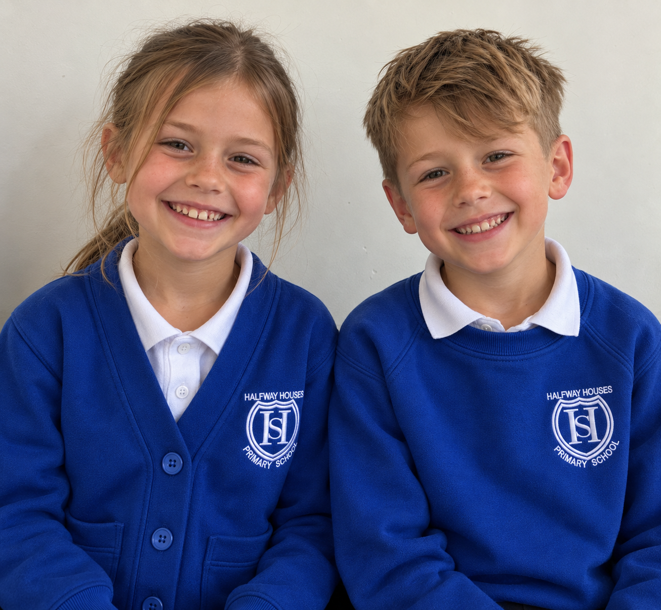 Smiling schoolmates in blue uniforms