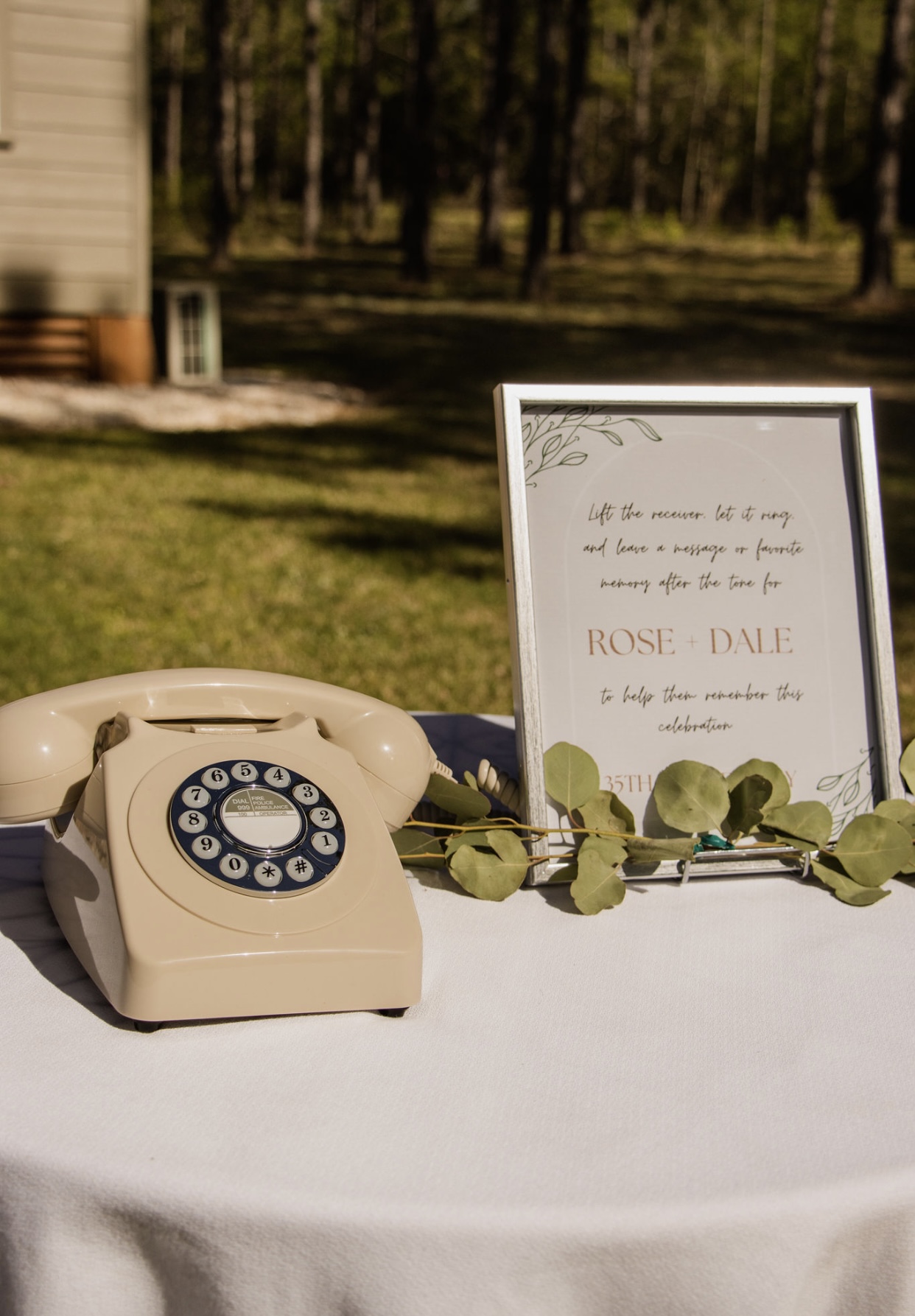 A charming table adorned with an old-fashioned phone and a message.