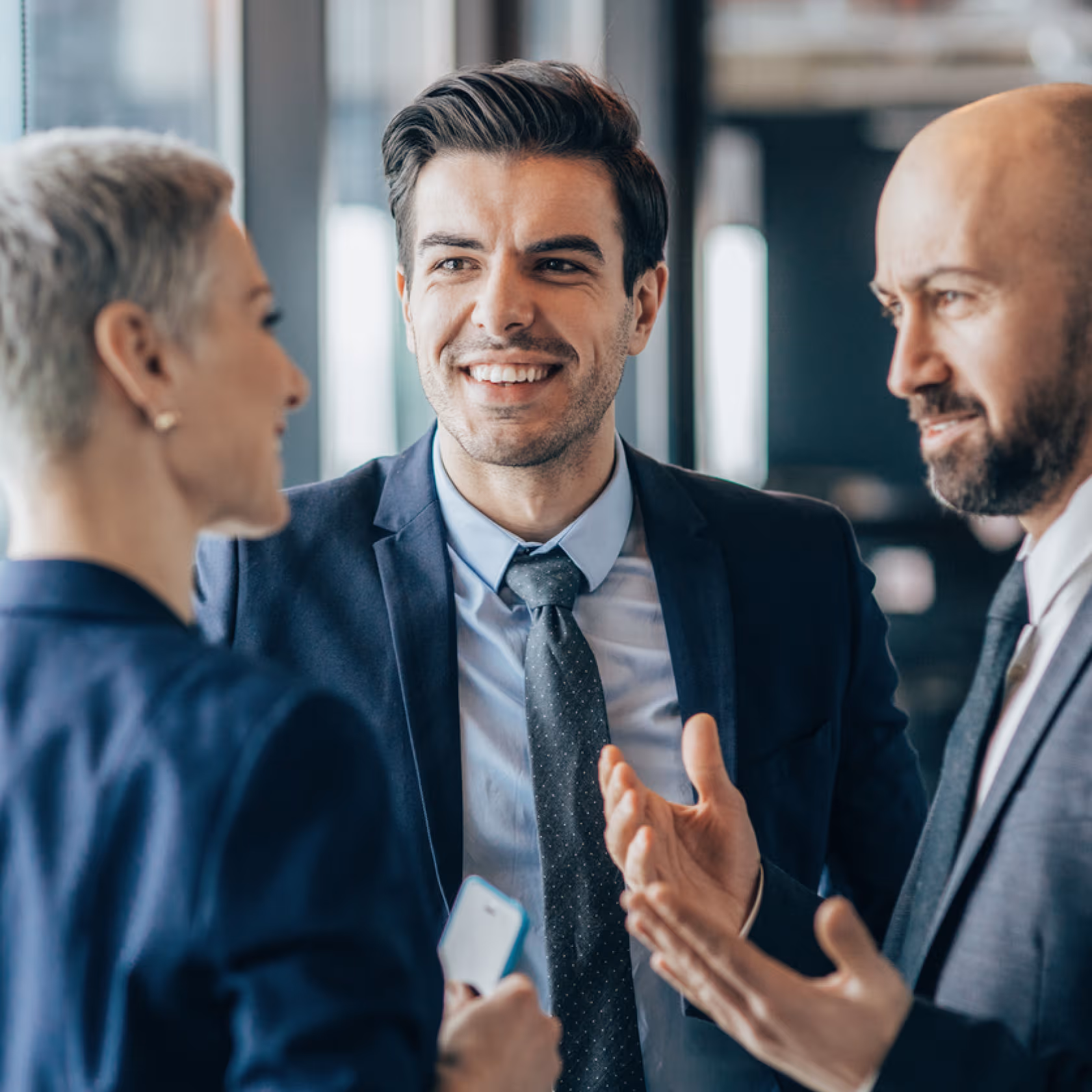 2 men and a women talking