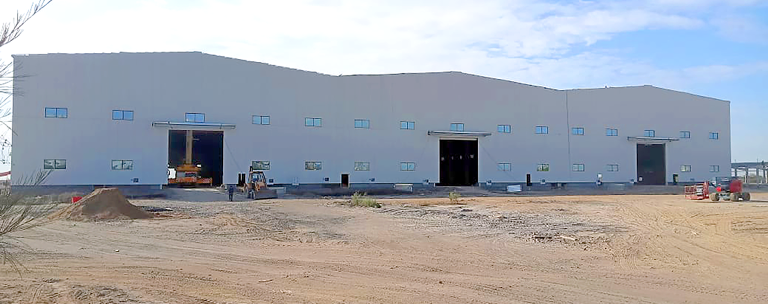 Phenix Structural Steel showcases PEB steel building solutions in a banner.