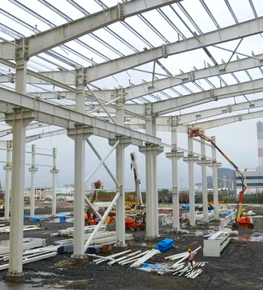 Plate fabricated beams in PEB structure fabrication by steel building company.