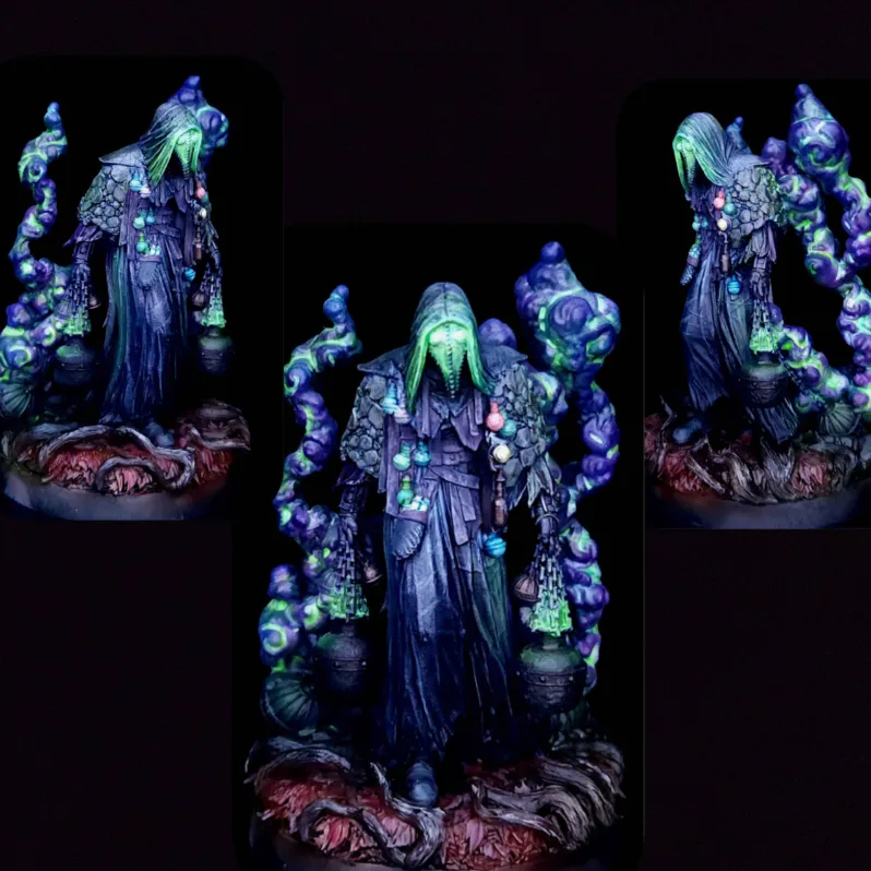 A detailed miniature figurine of a hooded figure in dark robes with glowing green face, holding two hanging incense burners emitting purple and green smoke, standing on a textured base with red and brown tones.