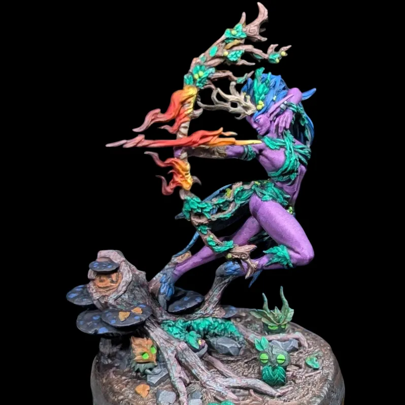 Detailed figurine of a purple-skinned archer with blue hair and green leaf-like clothing, shooting a flaming arrow, standing on a base with tree roots, mushrooms, and small green-eyed creatures.