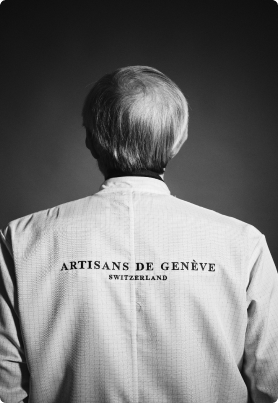 Black and white photo of a craftsman from Geneva taken from behind