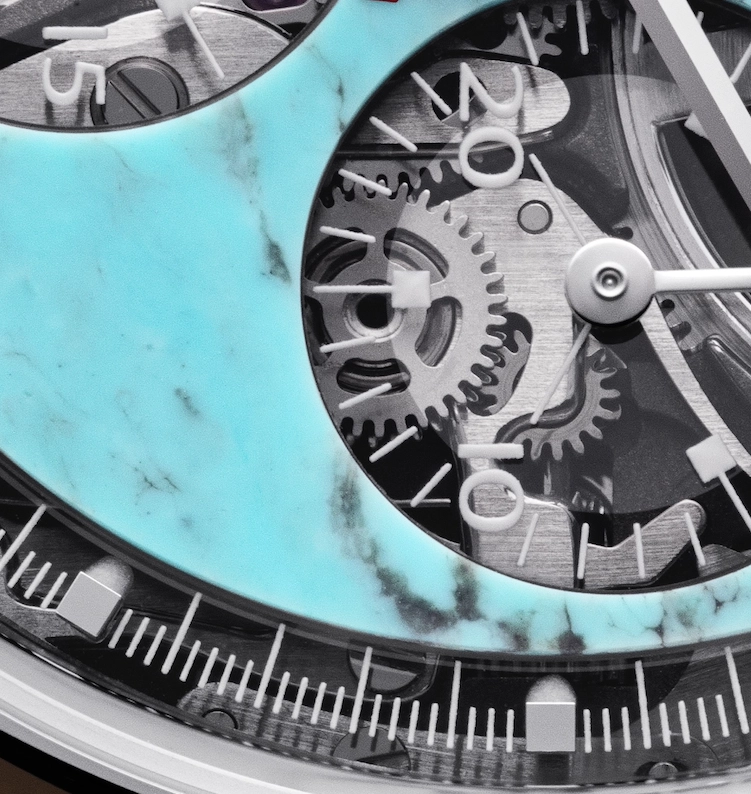 Close-up of a luxury watch face showing internal gears and a turquoise marbled design on the dial.
