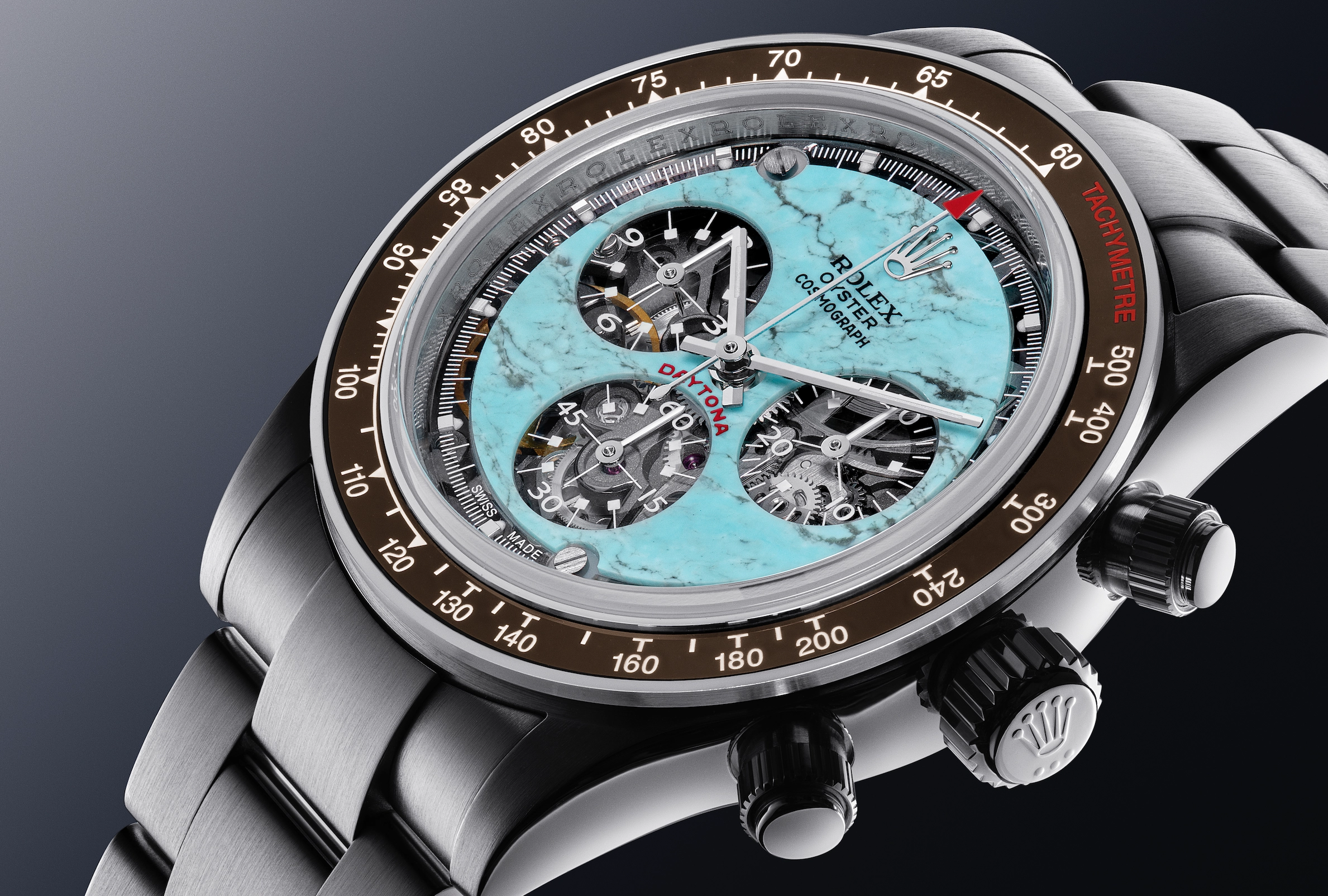 Close-up of a Rolex Oyster Cosmograph Daytona watch with a turquoise marble dial and visible mechanical components.