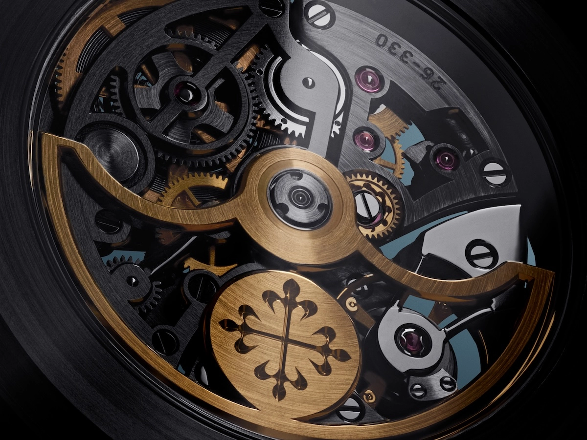 Close-up view of a watch's intricate mechanical movement with gold and steel gears and screws.