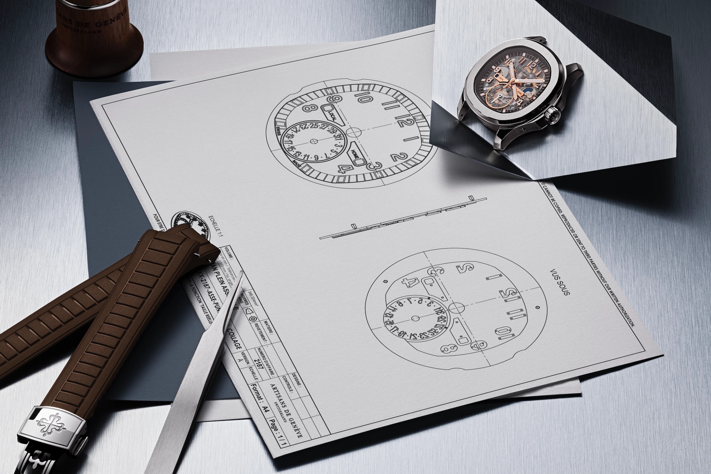 Watchmaking blueprints beside a skeleton watch, brown straps, and precision tweezers on a metal surface.
