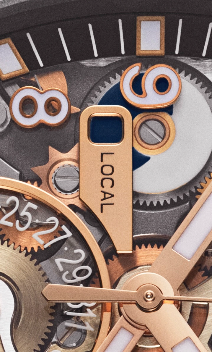 Close-up of a luxury watch mechanism with rose gold gears, hands, and a 'LOCAL' label.
