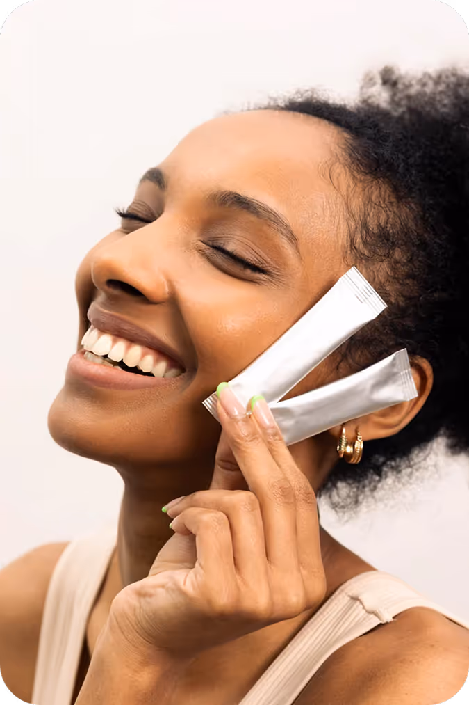 Smiling woman with Sova products in her hand